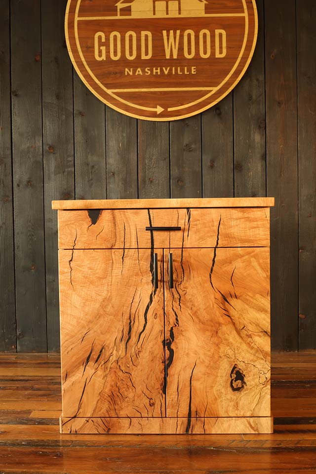 Custom woodworking magic maple cabinet